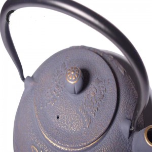 Cast iron teapot with flower design