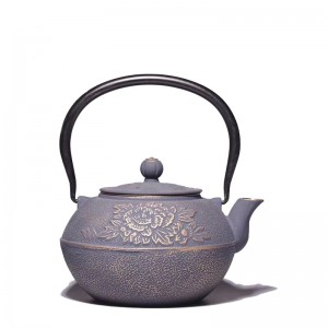 Cast iron teapot with flower design